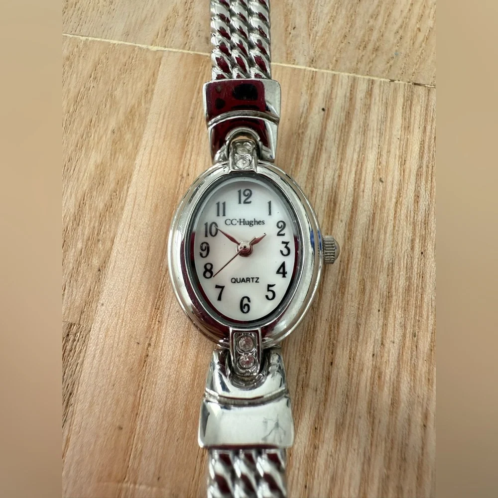 CC Hughes ladies oval silver tone watch NEW BATTERY